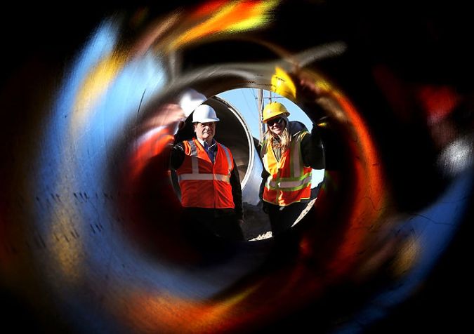 John Collins and Tara Bevard discuss new sewer line along Capital Avenue.